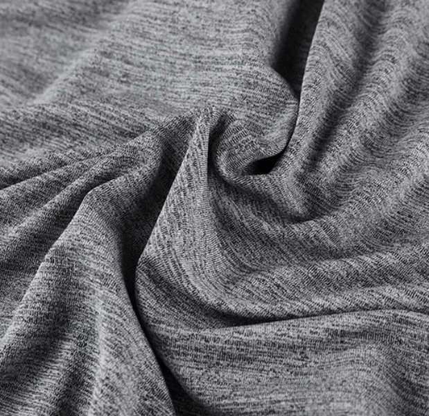Close-up of gray polyester spandex fabric with a soft, breathable texture ideal for men's athletic wear.